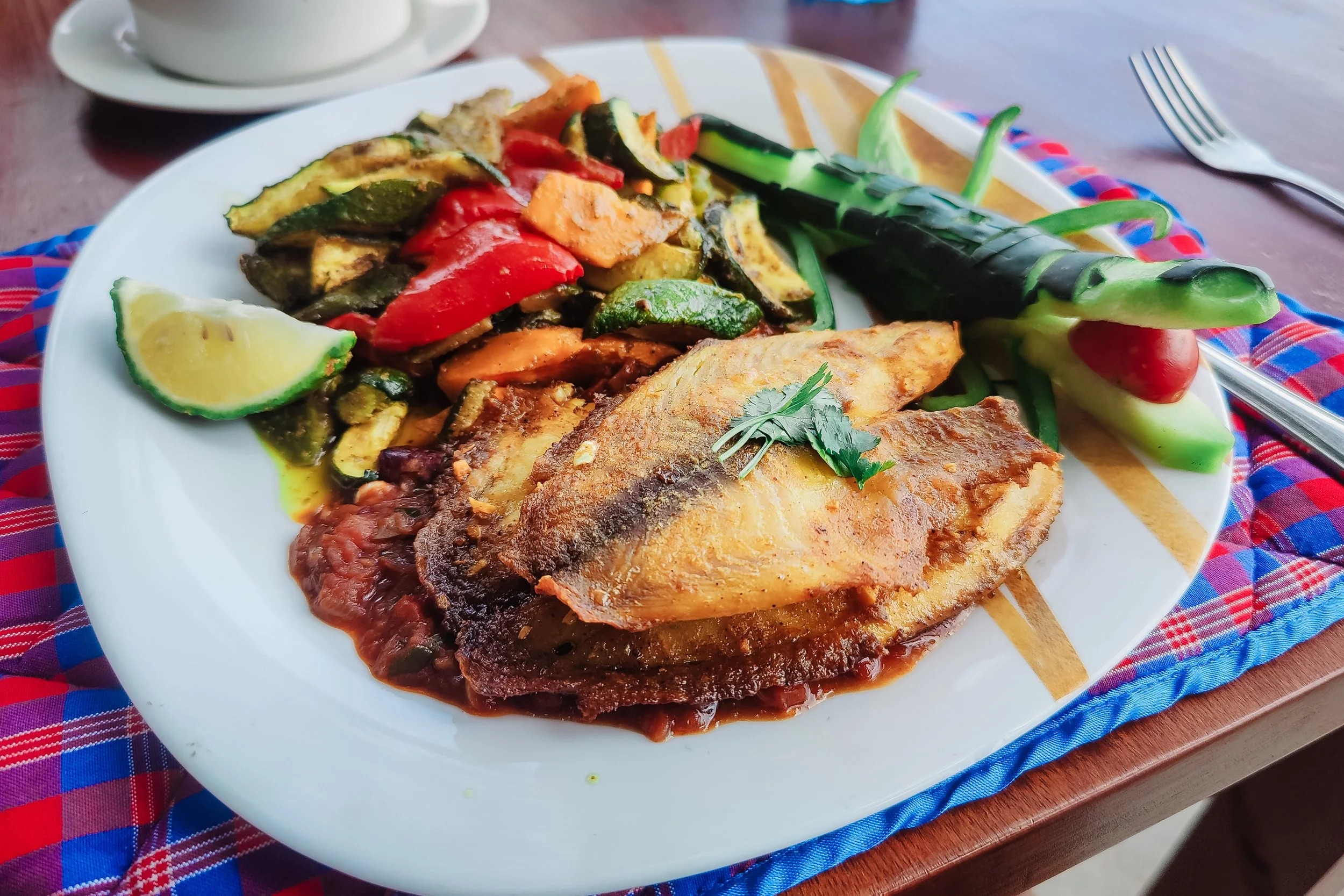 Pan-fried Nile perch with roasted vegetables and relish served at Enkoropil Mara Camp