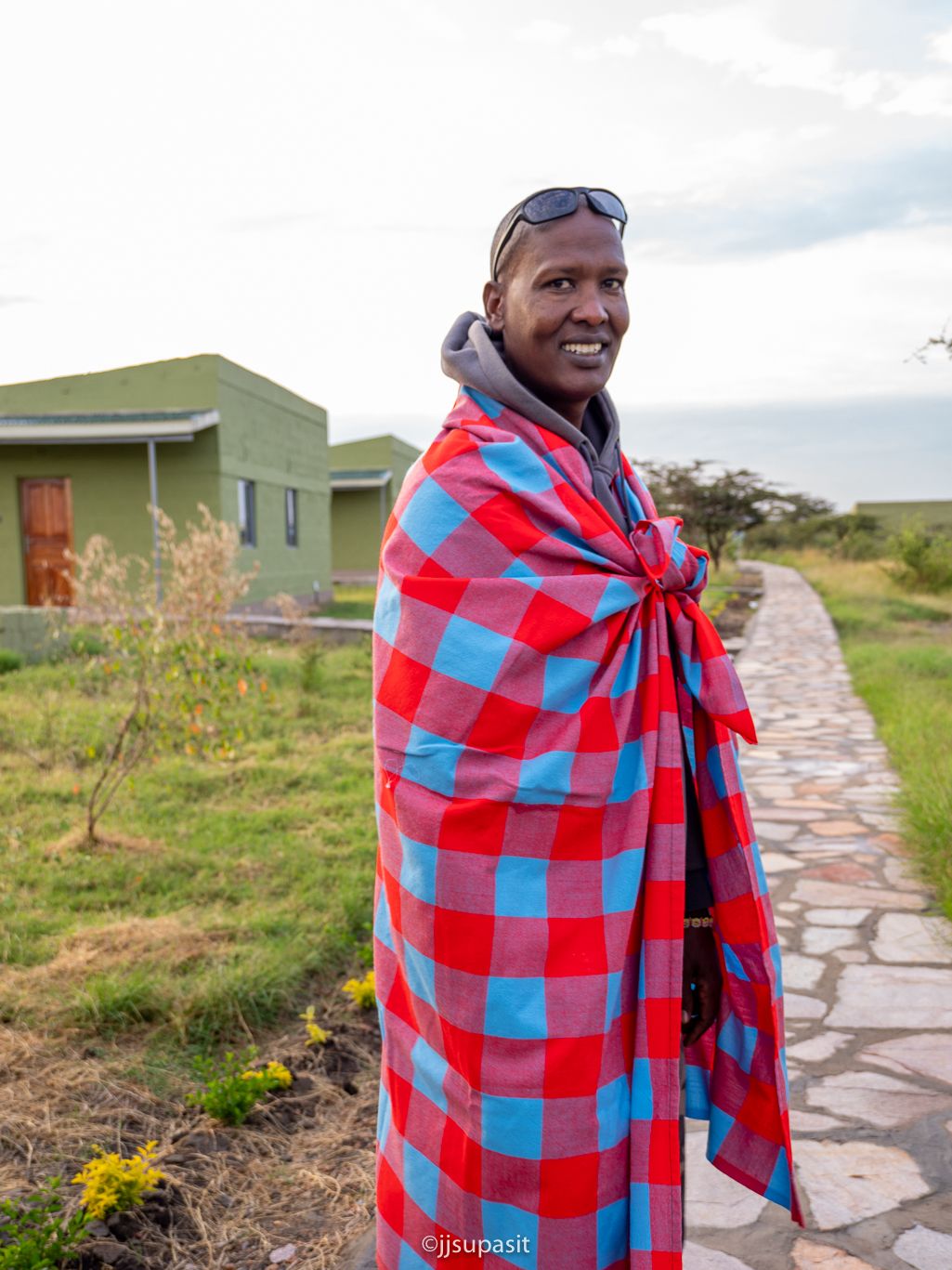 Simon, Enkoropil Mara Camp owner and KPSGA-licensed Maasai guide, on the camp's stone pathway